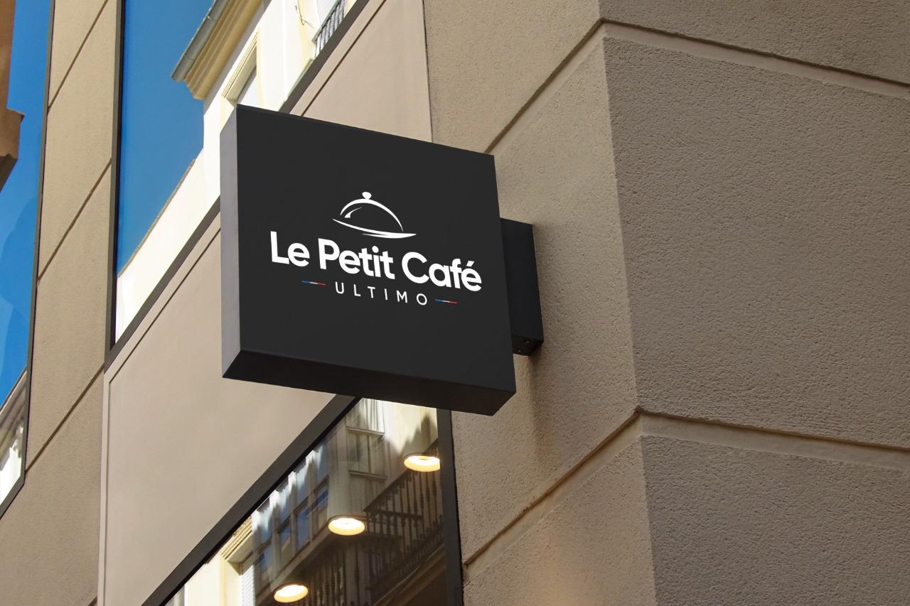 Le Petit Café square blade sign on a building