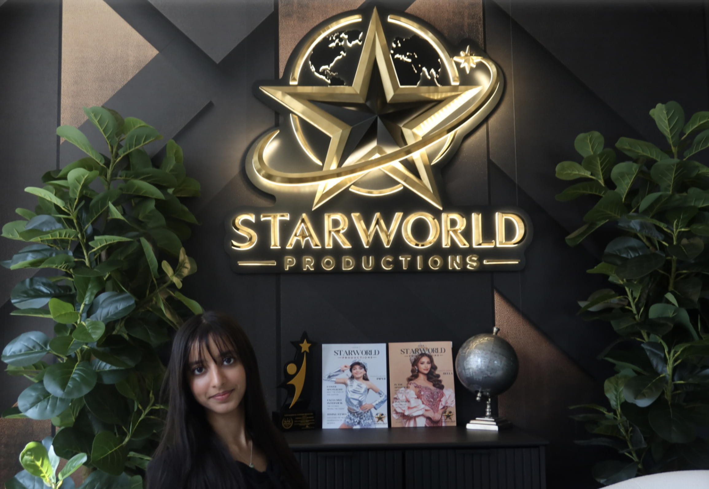 Guest at the Starworld Productions logo wall